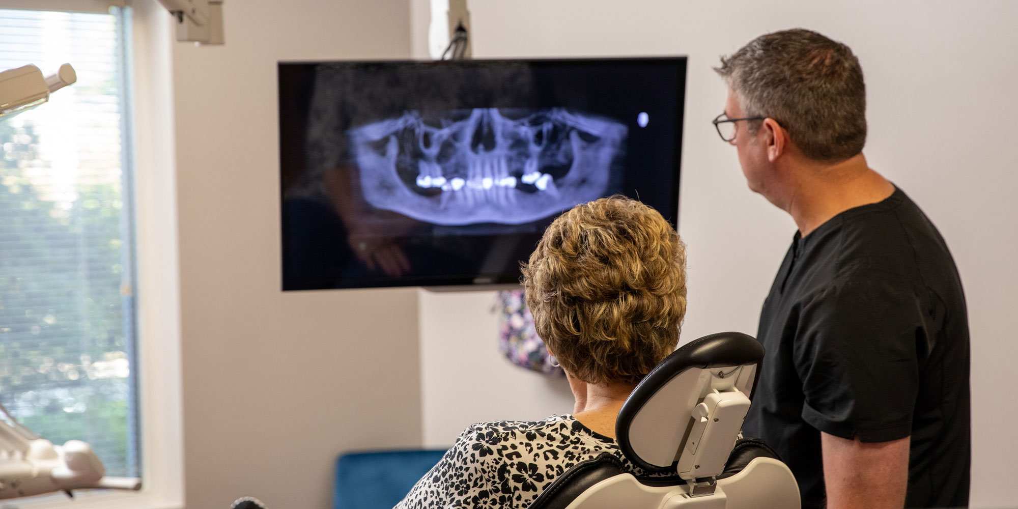 Dr. Rogers explaining oral surgery procedure